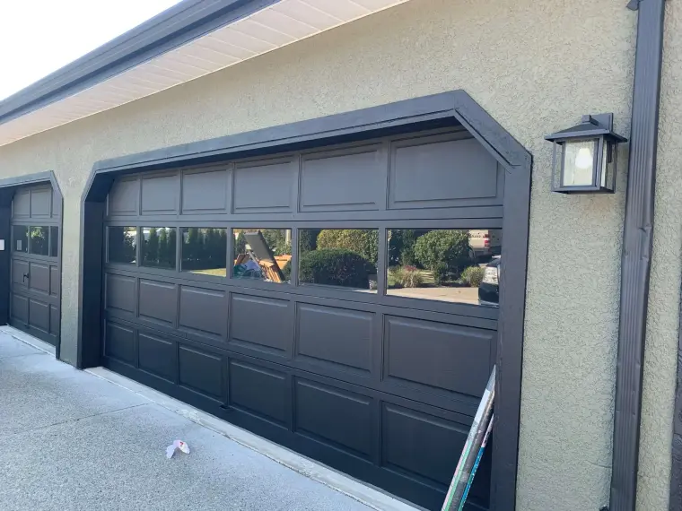 Freshly painted dark charcoal garage door with glass panels, garage door painting by Colour Craft Painting