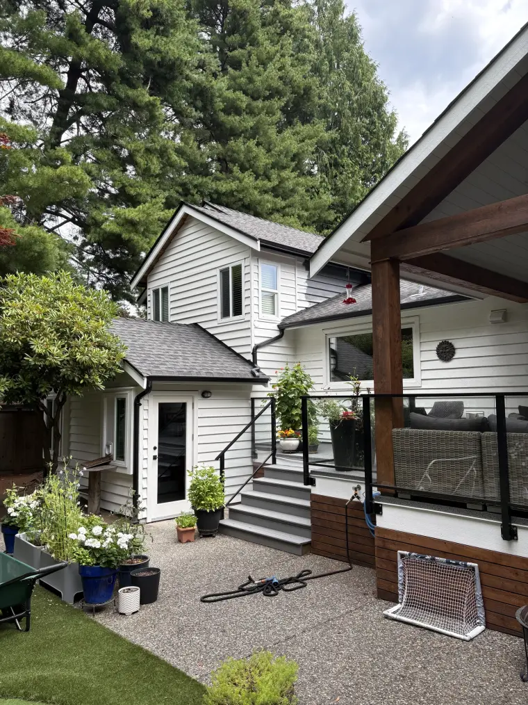 Repainted white siding and trim on a Tsawwassen home, exterior painting by Colour Craft Painting
