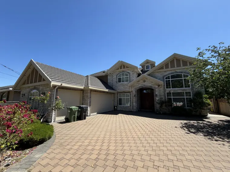 Completed acrylic stucco exterior on a Seafair home in Richmond, painted by Colour Craft Painting