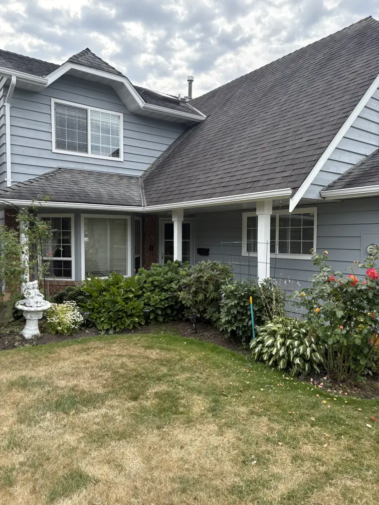 Two-tone exterior with crisp white trim on a Steveston home, painted by Colour Craft Painting